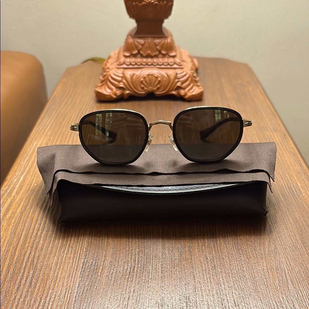 Persol sunglasses. Made in Italy, polarized lenses. Very are sleek and sexy.